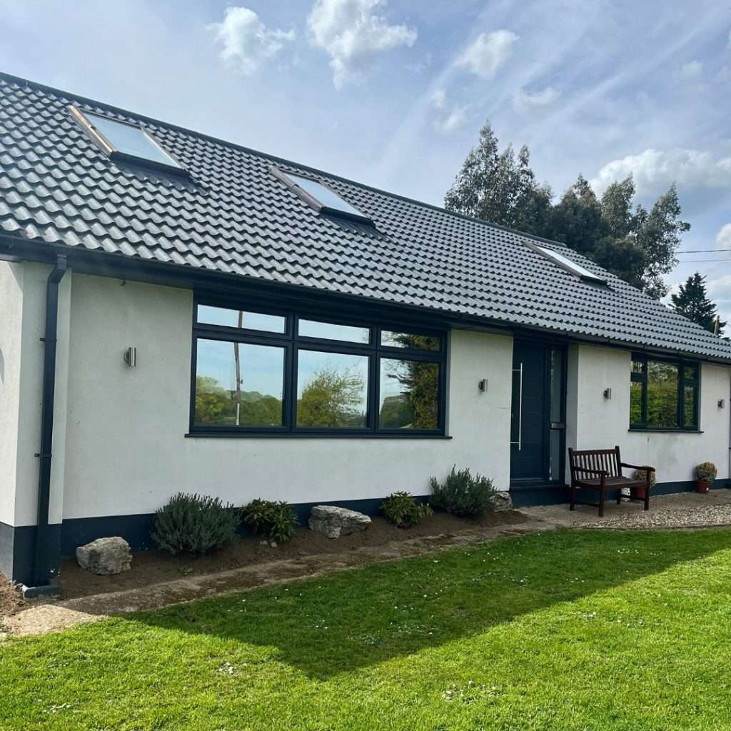 Silver 20 reflective solar film applied to a large bungalow for UV protection and heat control
