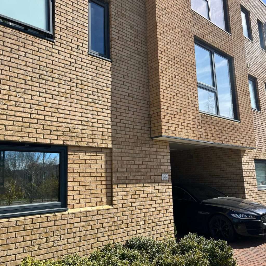 Silver 20 reflective solar film applied to windows of a client’s development for daytime privacy from the street