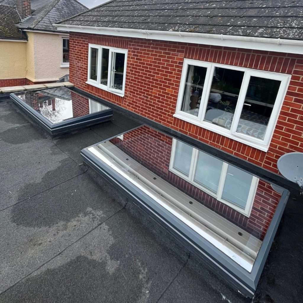 Silver 20 reflective solar film fitted externally to two flat skylights for superior sun protection