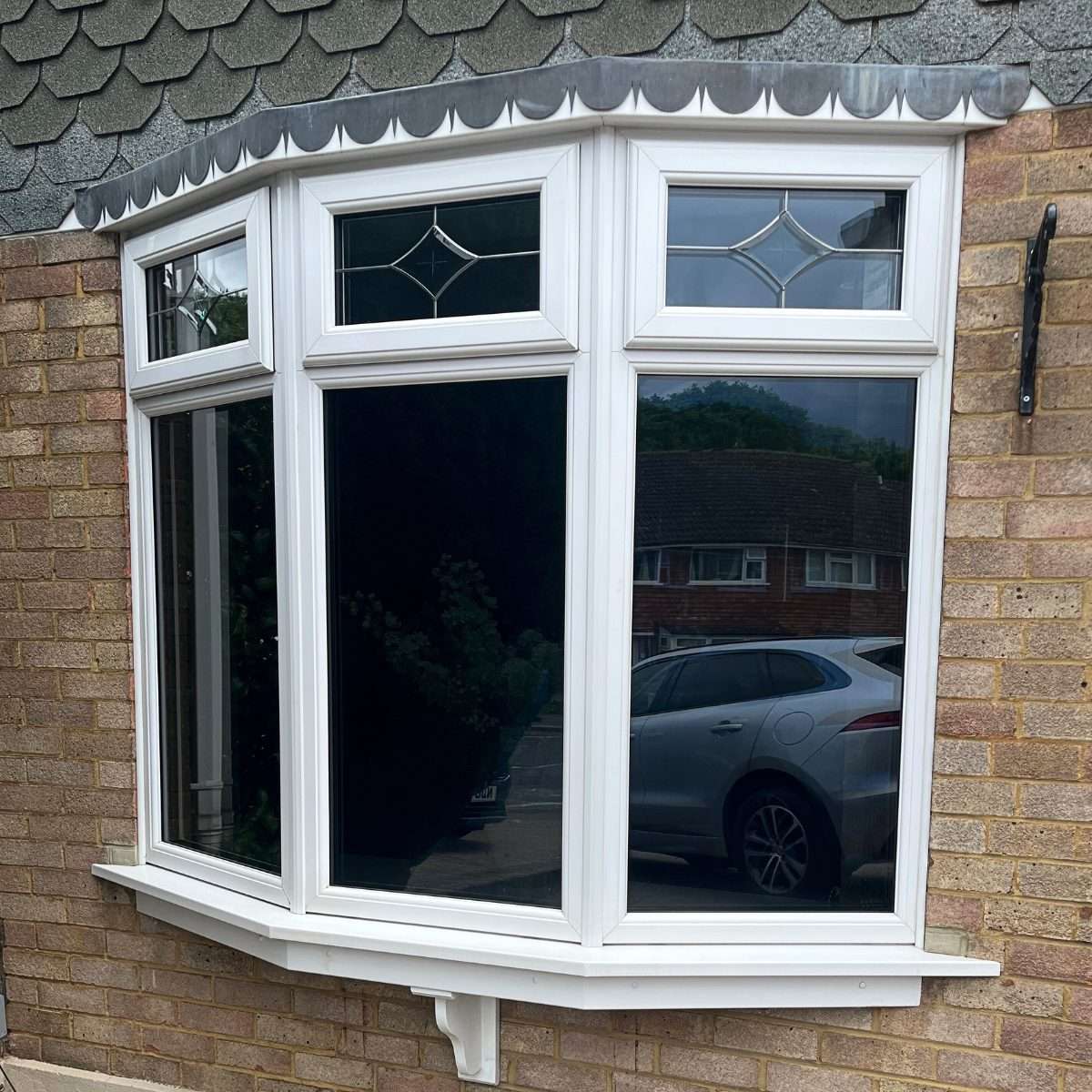 Tinted solar window film applied to bay windows, providing daytime privacy and solar control