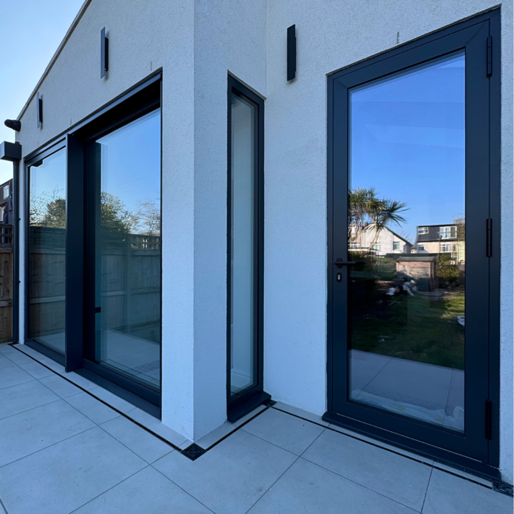 Silver 20 reflective solar film combined with security film applied to the rear of the property for added privacy, solar control, and strengthened glass