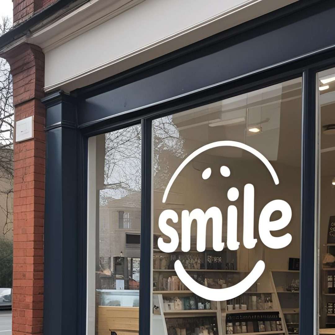 Branding window film with Smile logo applied to shopfront glass