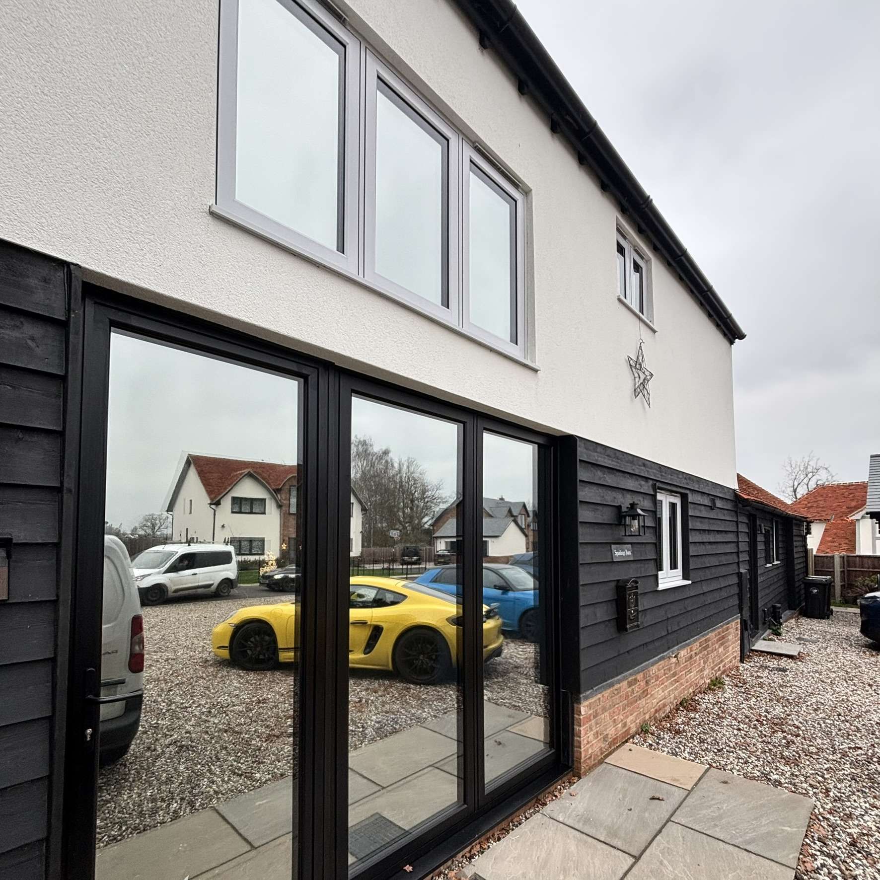 Exterior view of a residential property in Braintree with Silver 20 window film applied for privacy and a modern aesthetic.