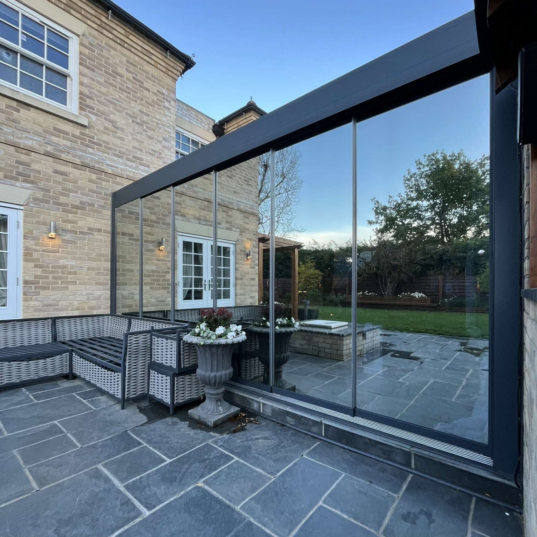 Side view of Silver 20 reflective solar film installed around a pergola in Colchester for complete privacy and protection from UV damage.