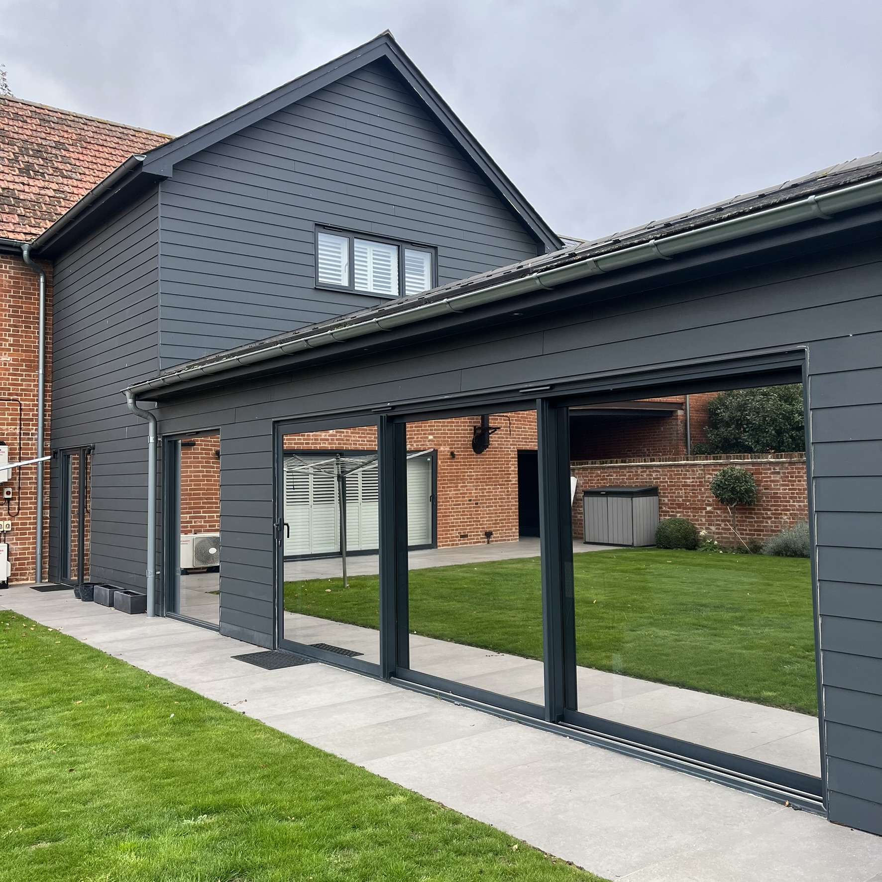 External view of a residential property in Ipswich fitted with Silver 20 reflective solar window film, providing privacy and year-round solar control.