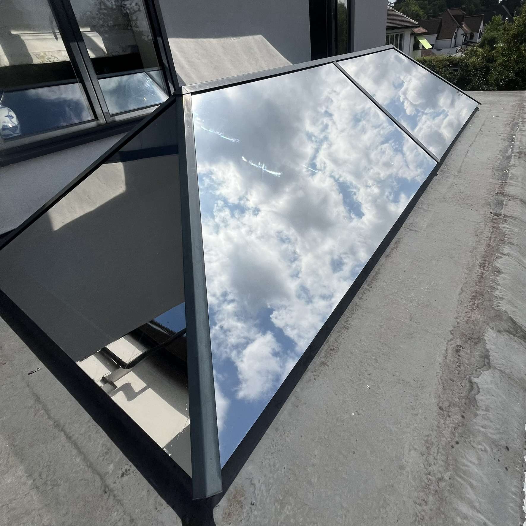 External view of a residential skylight in Kingston upon Thames fitted with Silver 20 reflective solar window film, helping control heat, glare, and UV exposure.