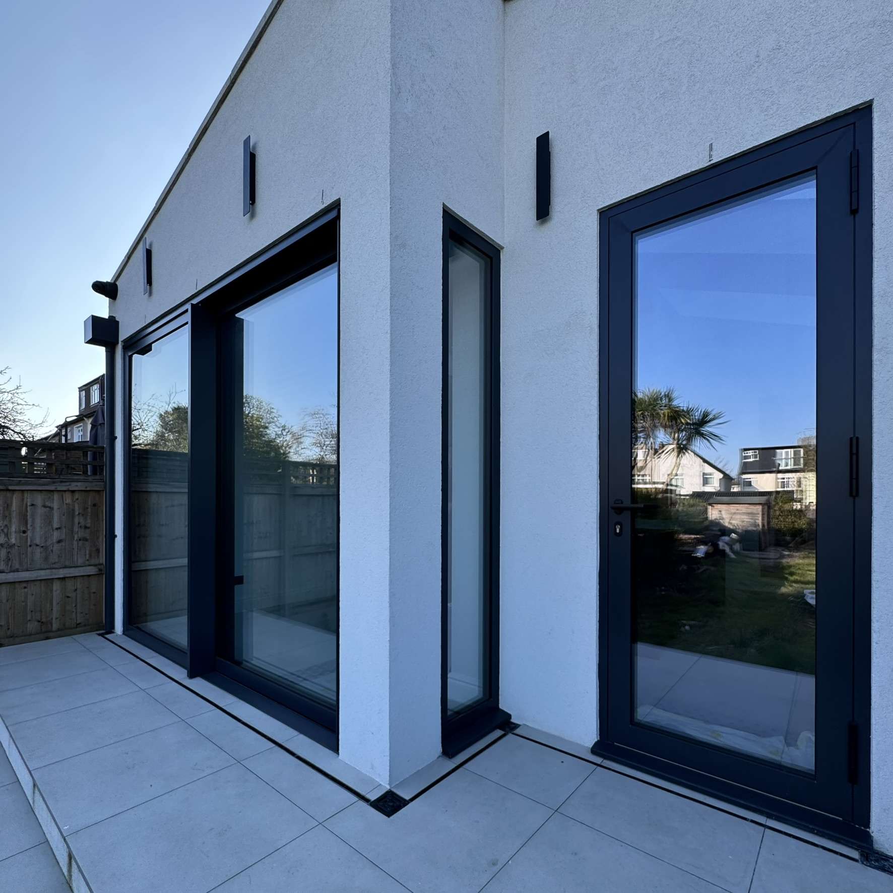 External rear view of a residential property in Ongar fitted with Silver 20 reflective solar window film, adding privacy from neighbours while helping block UV exposure.