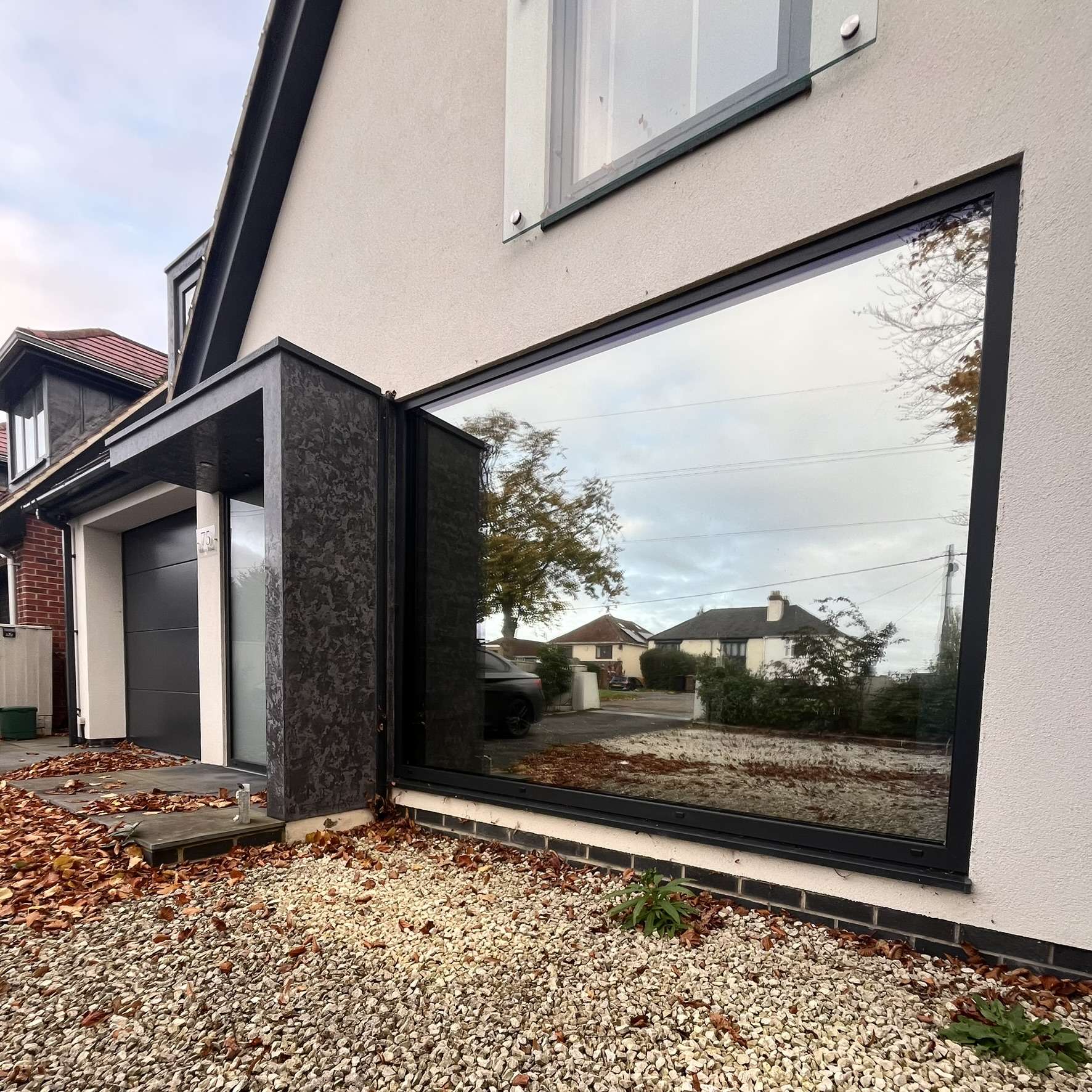 Silver 20 reflective solar film applied to a large window in Oxford for privacy, with a discreet join.
