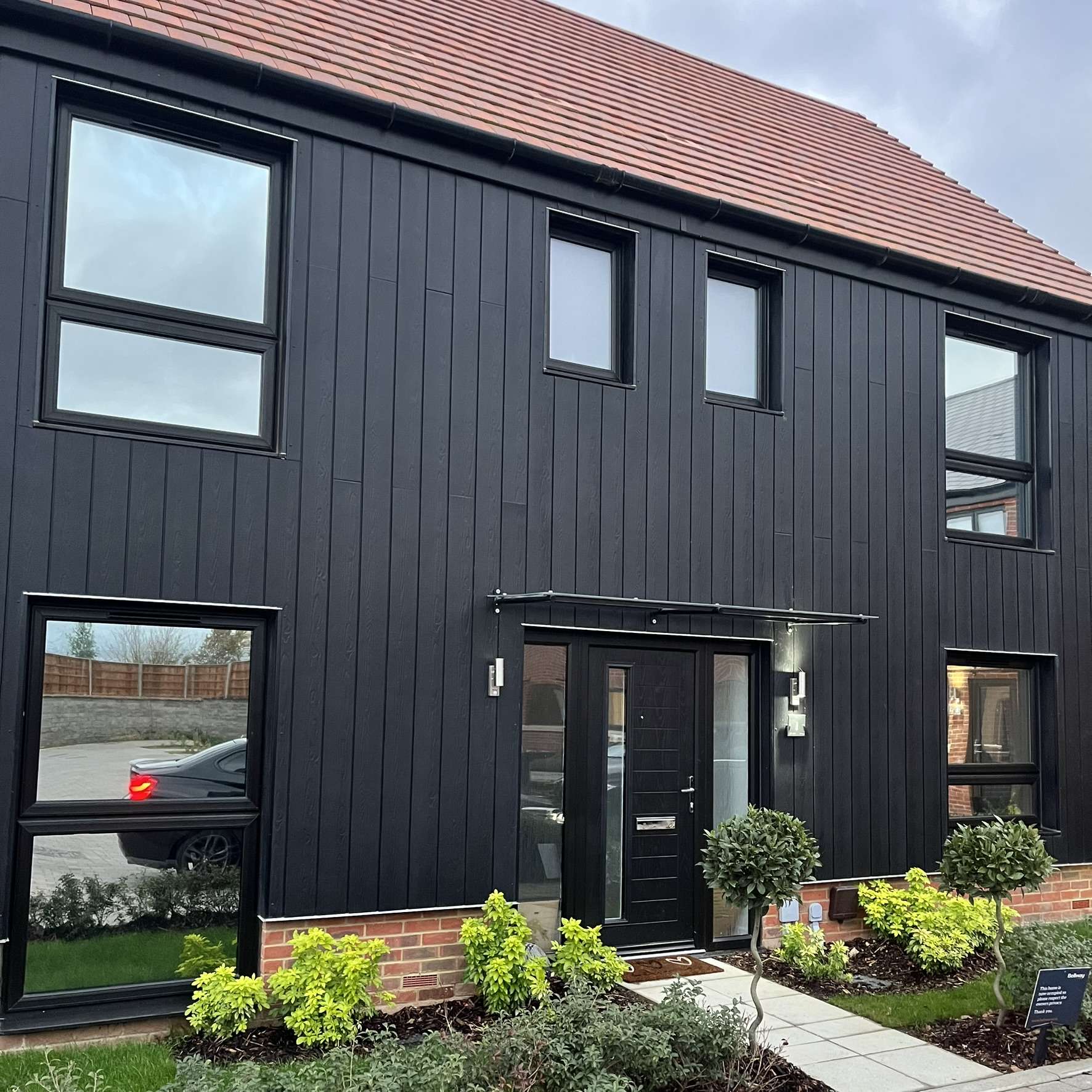 Silver 20 reflective solar film applied to the front of a property in Rayleigh for daytime privacy.
