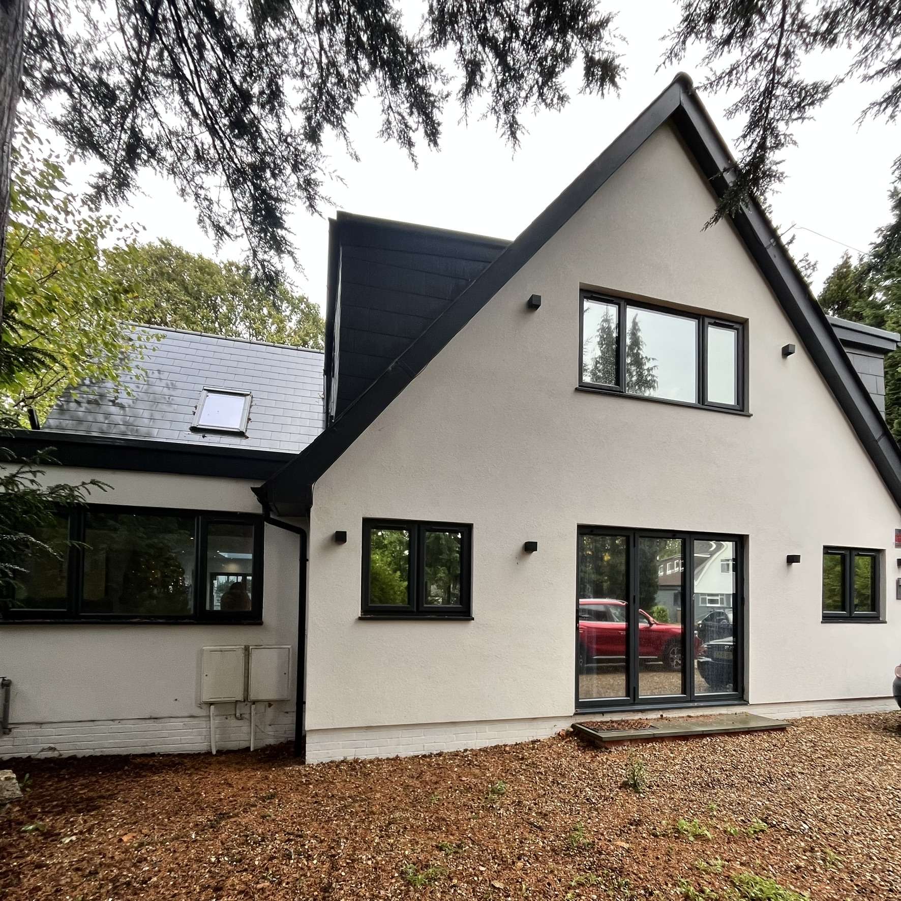 Silver 20 reflective solar film applied to a house in Surrey for energy efficiency.