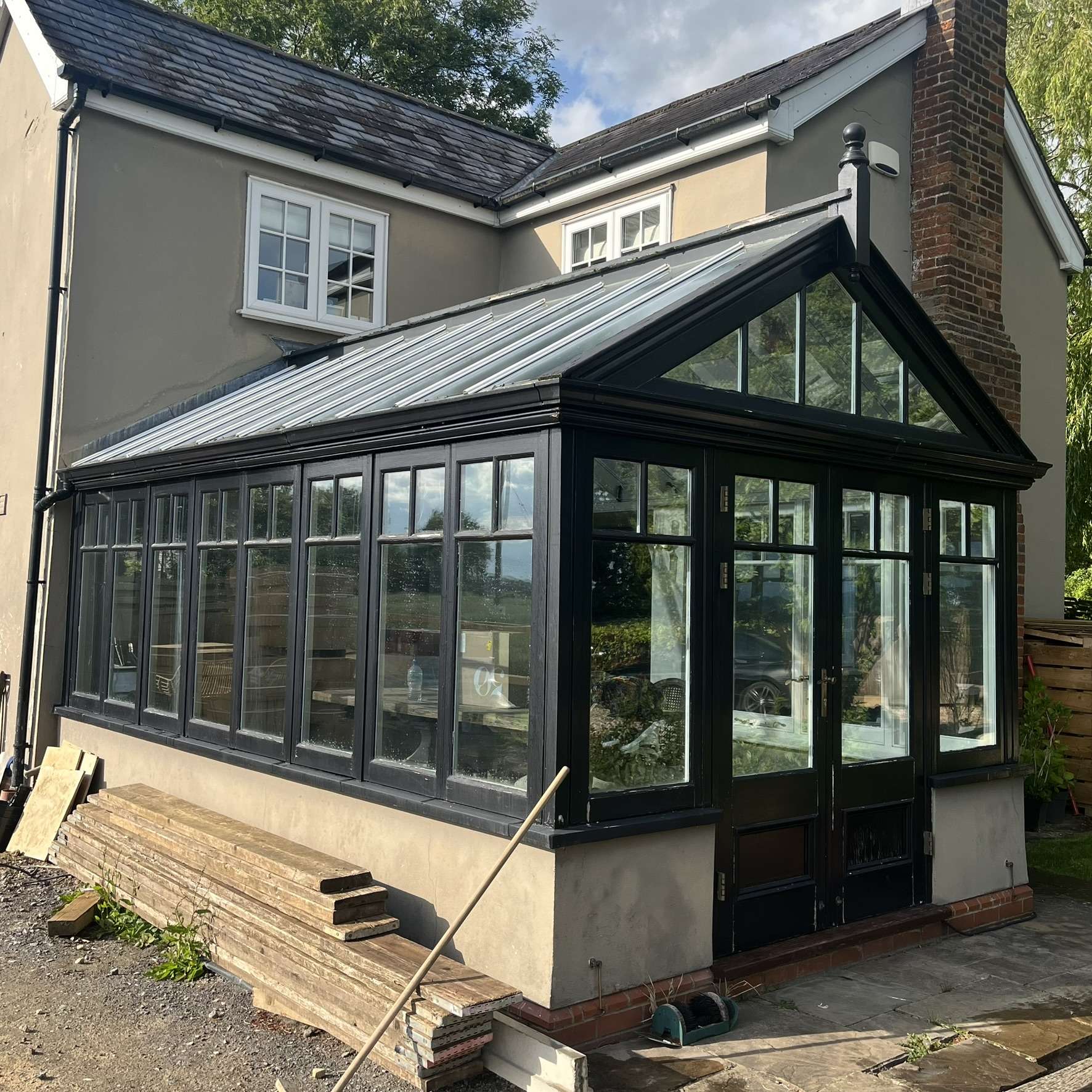 Silver 20 reflective solar film installed on conservatory roof panes and Silver 50 applied to side panes in Essex to provide complete year round solar control and improved comfort.