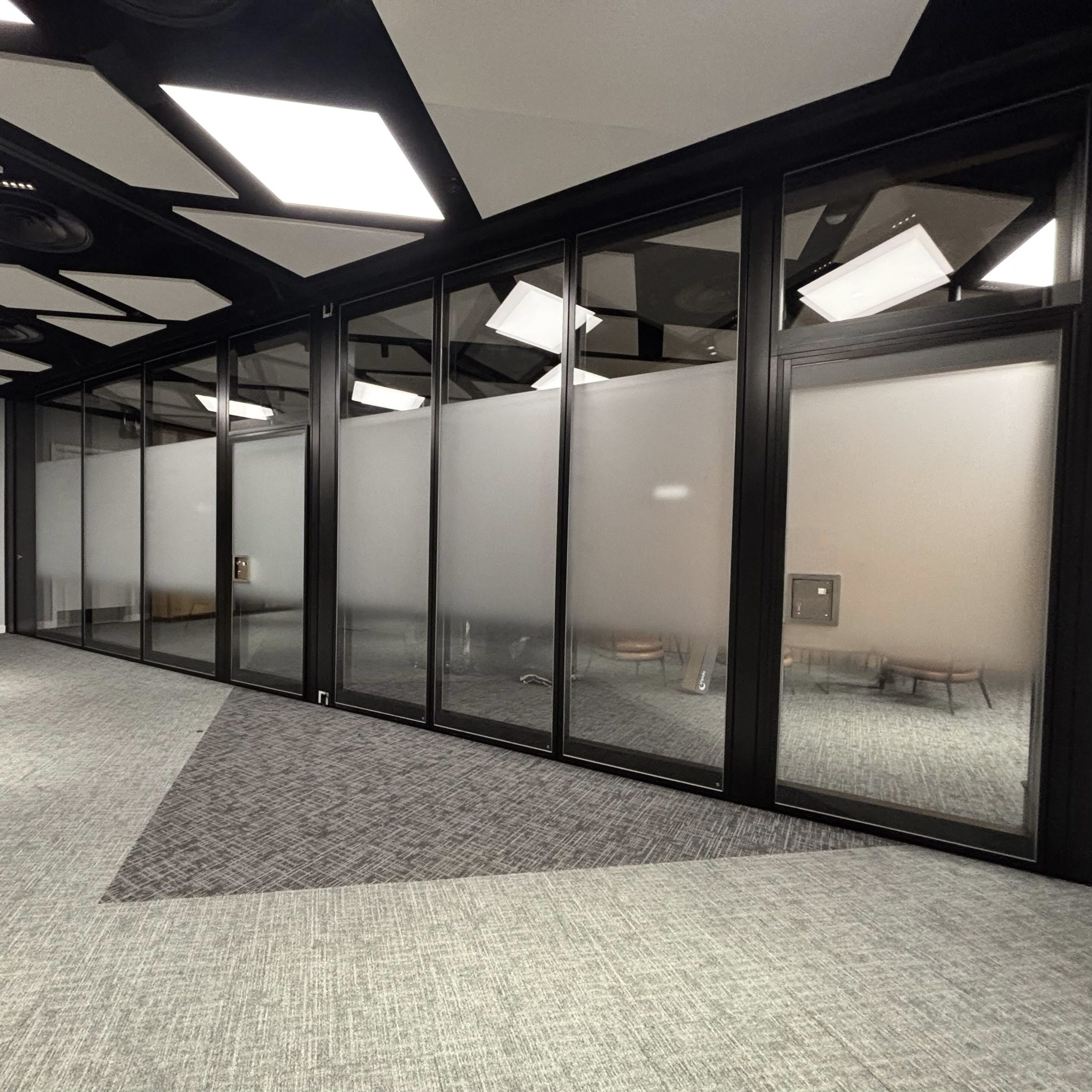 Interior view of a London meeting room at Bank of America with graduated frosted window film applied across the glazing, providing privacy with a sleek, modern finish.