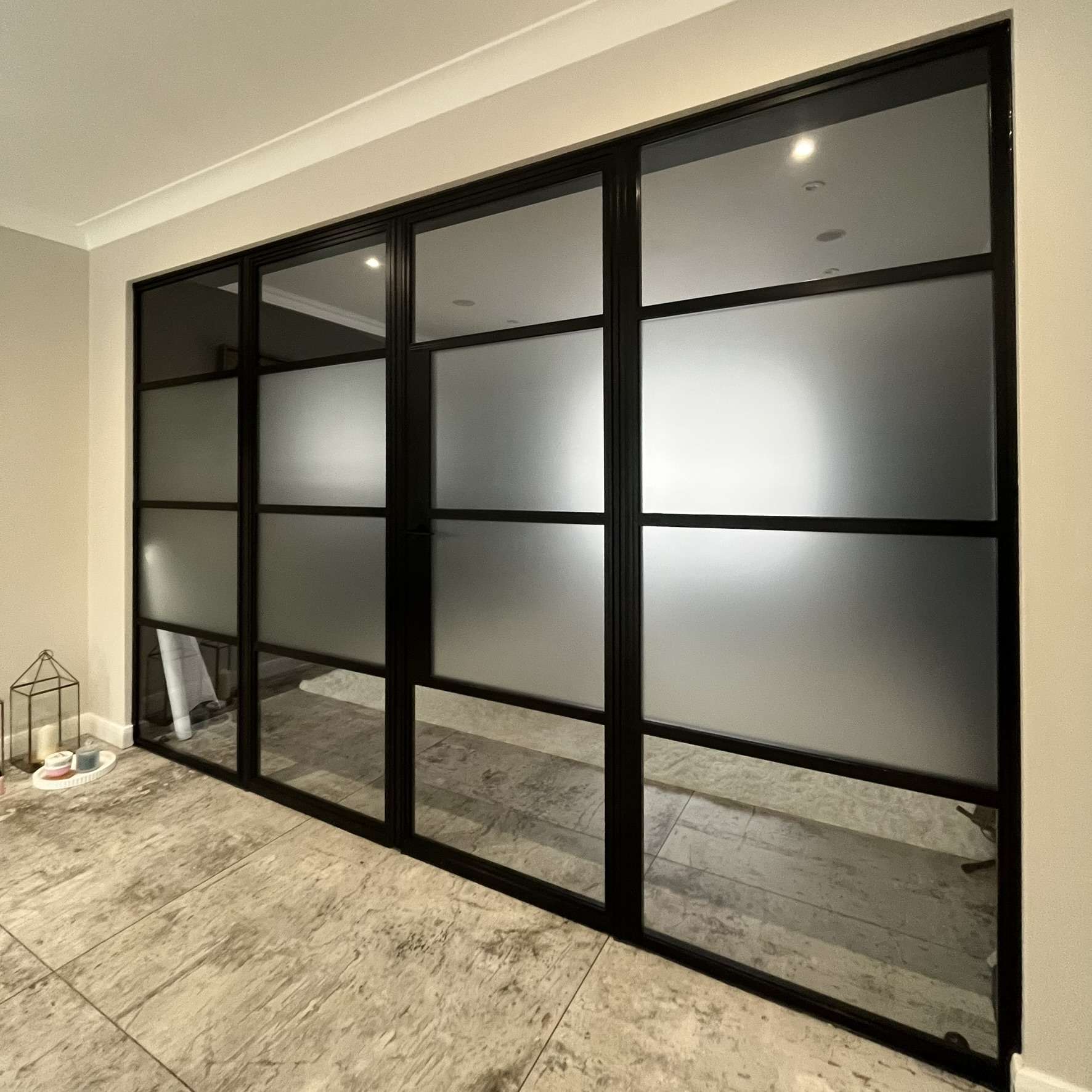 Internal view of glazing in Southend with frosted window film applied to the middle panels, improving privacy and security between adjoining rooms while allowing light through.