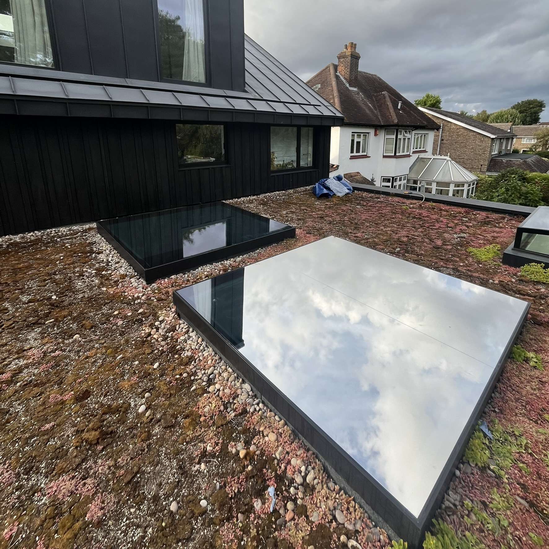 External view of two large skylights in Beckenham fitted with external Silver 20 reflective solar window film, providing year-round solar control.