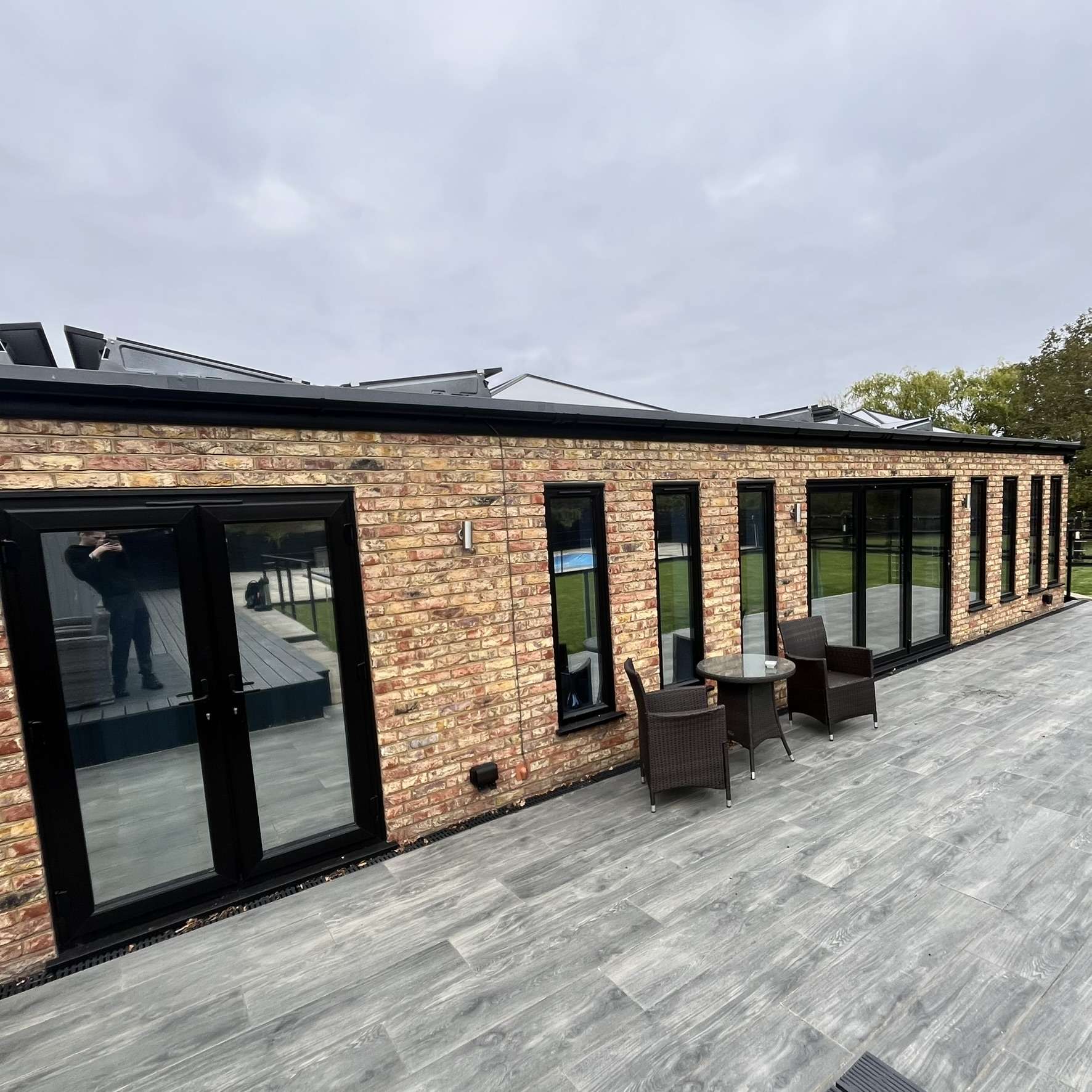 Close-up external view of rear glazing on a Benfleet property with Silver 20 reflective solar window film installed, highlighting privacy and solar heat reduction.