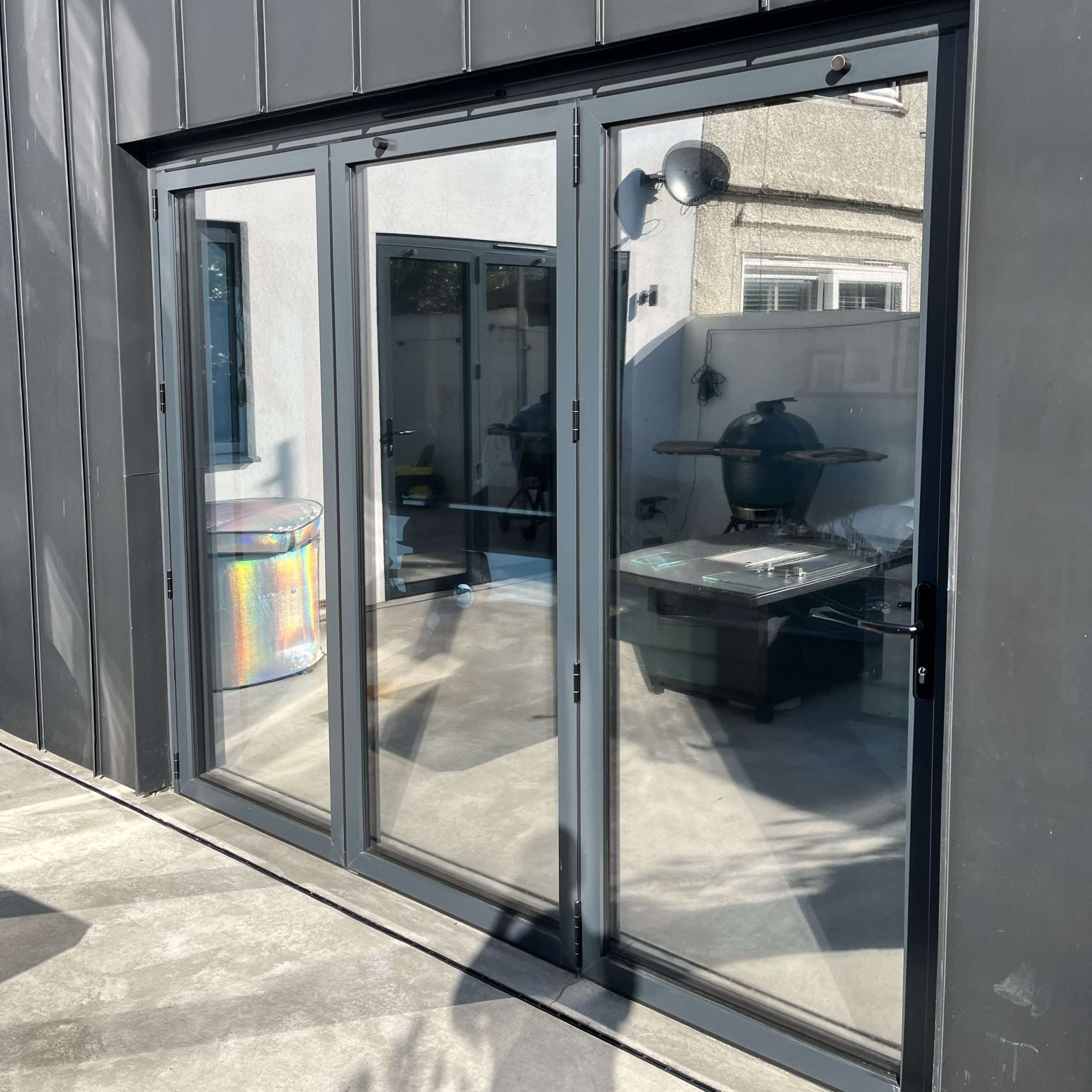 External view of glass doors in Brentwood fitted with Silver 20 reflective solar window film, helping reduce heat build-up and glare.