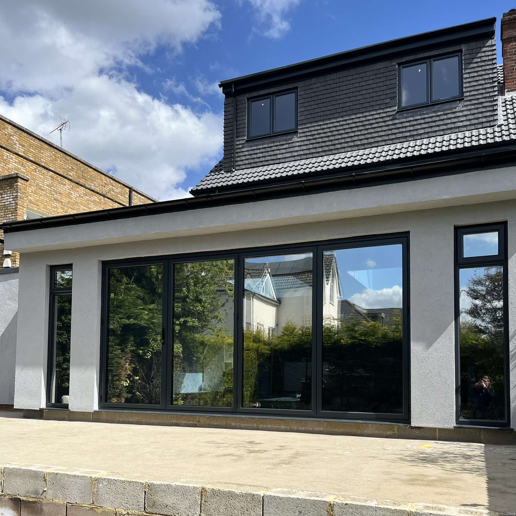 External rear view of a residential property in Croydon fitted with Silver 20 reflective solar window film, enhancing privacy and helping manage solar heat.