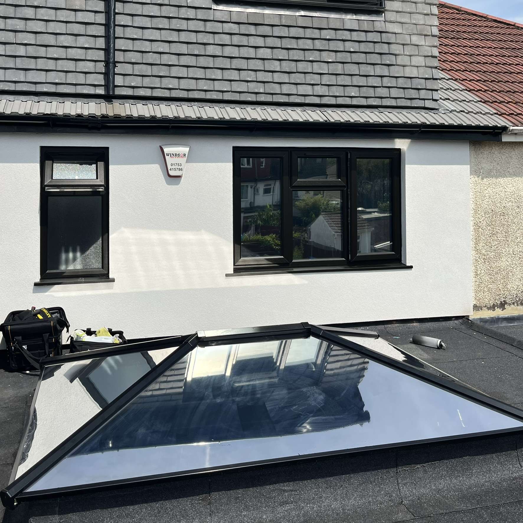 External view of a roof skylight in Harrow fitted with external Silver 20 reflective solar window film, providing year-round solar control.