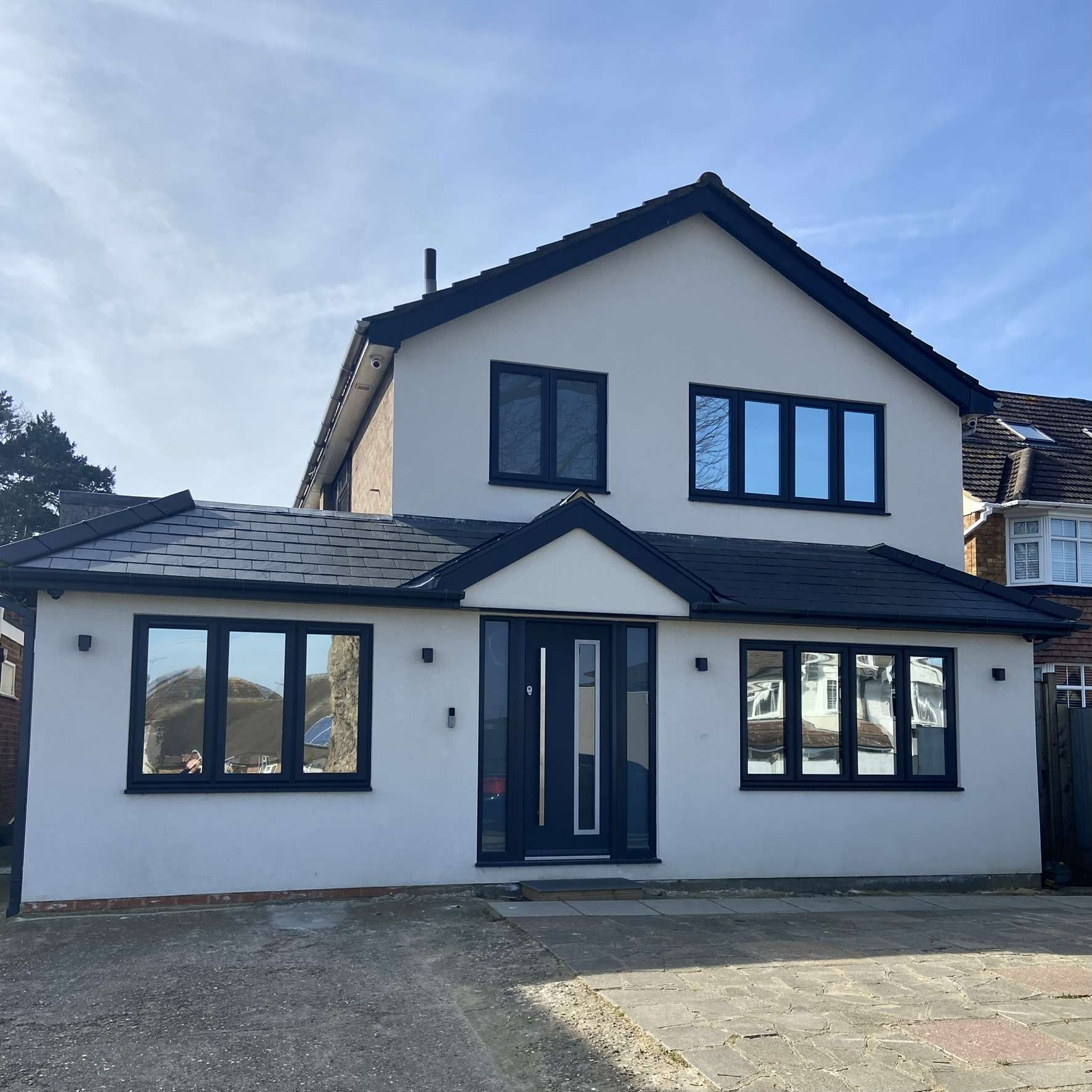 External front view of a large home in Hertfordshire fitted with Silver 20 reflective solar window film, providing privacy while helping manage heat year-round.