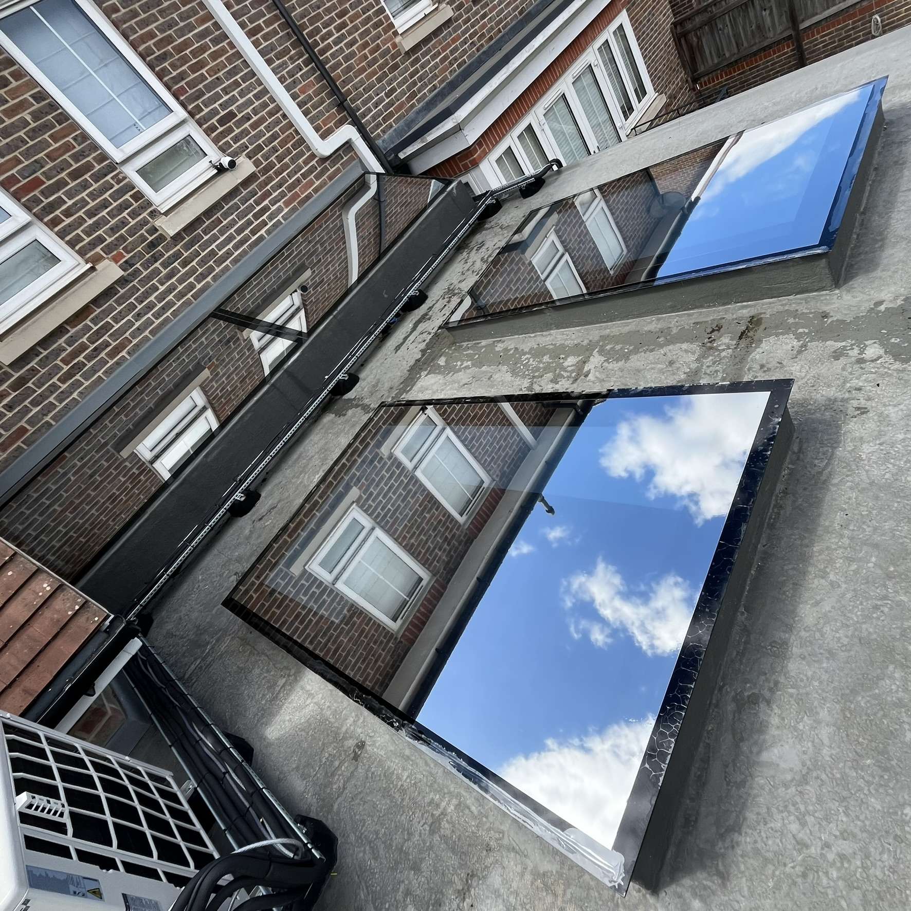 External view of roof skylights in High Wycombe fitted with external Silver 20 reflective solar window film, reducing heat, glare, and UV exposure year-round.