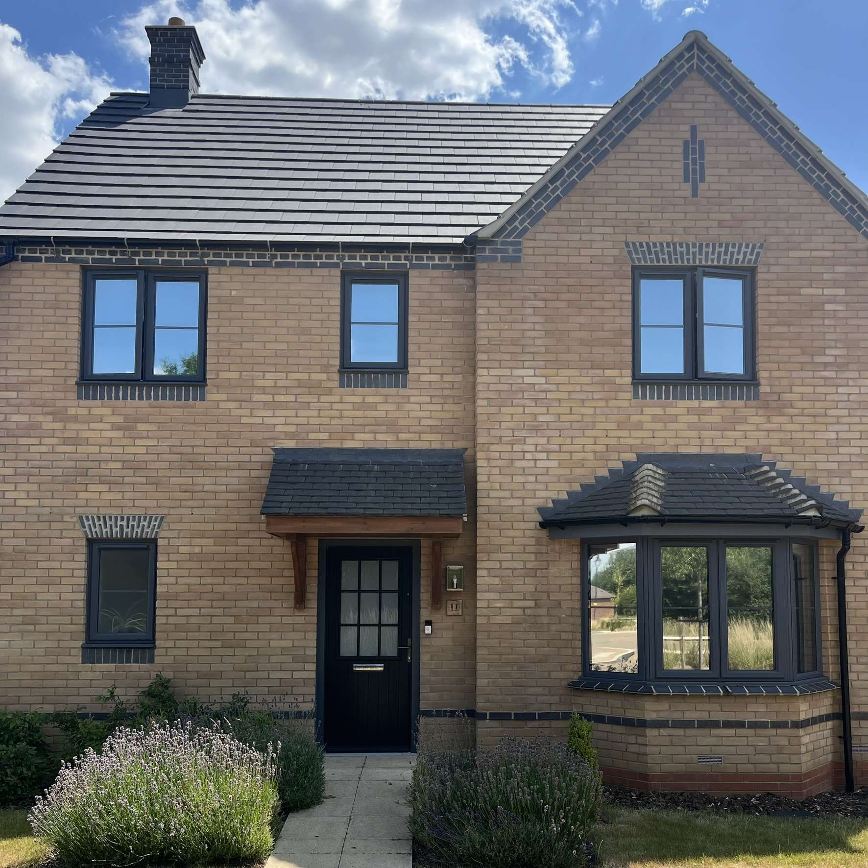 External front view of a home in Milton Keynes with Silver 20 reflective solar window film installed, providing privacy while helping manage solar heat.