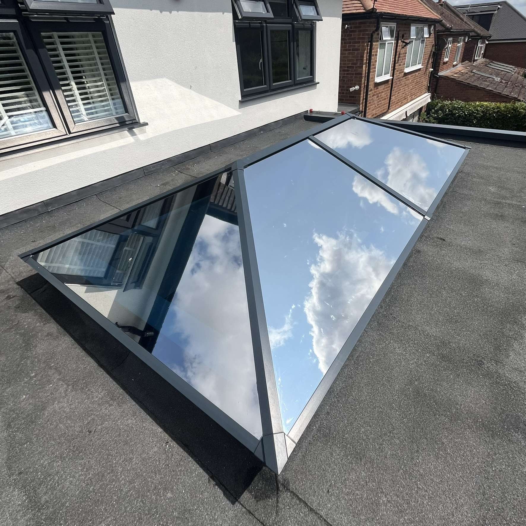 External view of a roof skylight in Watford fitted with Silver 20 reflective solar window film, providing solar control to help manage heat and brightness.
