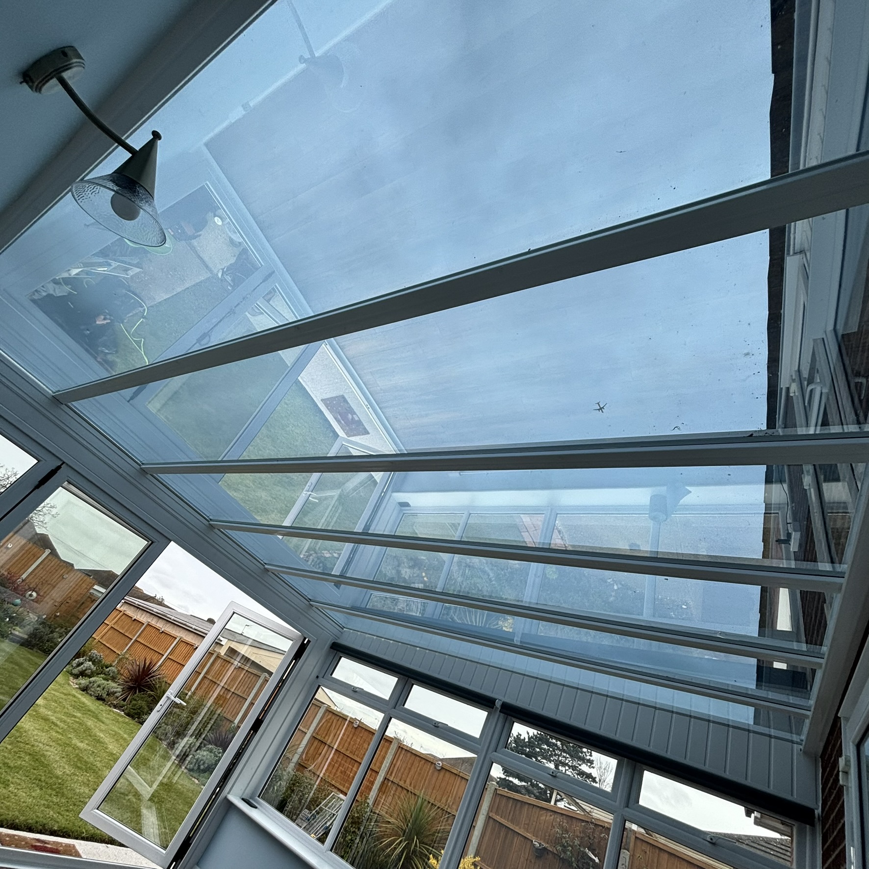 Internal view of a conservatory roof in Canvey Island fitted with Silver 20 reflective solar window film, improving comfort with year-round solar control.