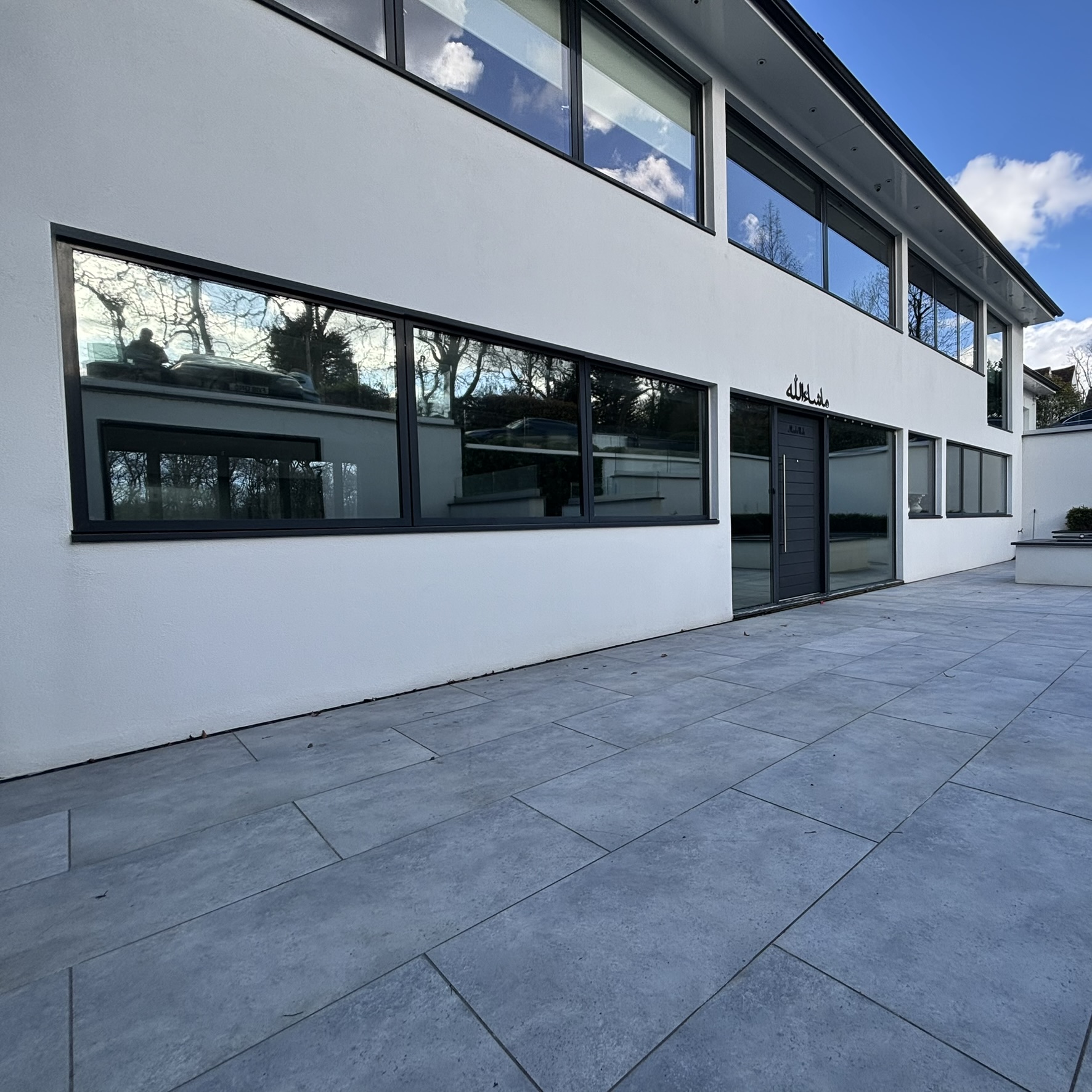 External front view of a large residential property in Potters Bar fitted with Silver 20 reflective solar window film, providing daytime privacy and UV protection.