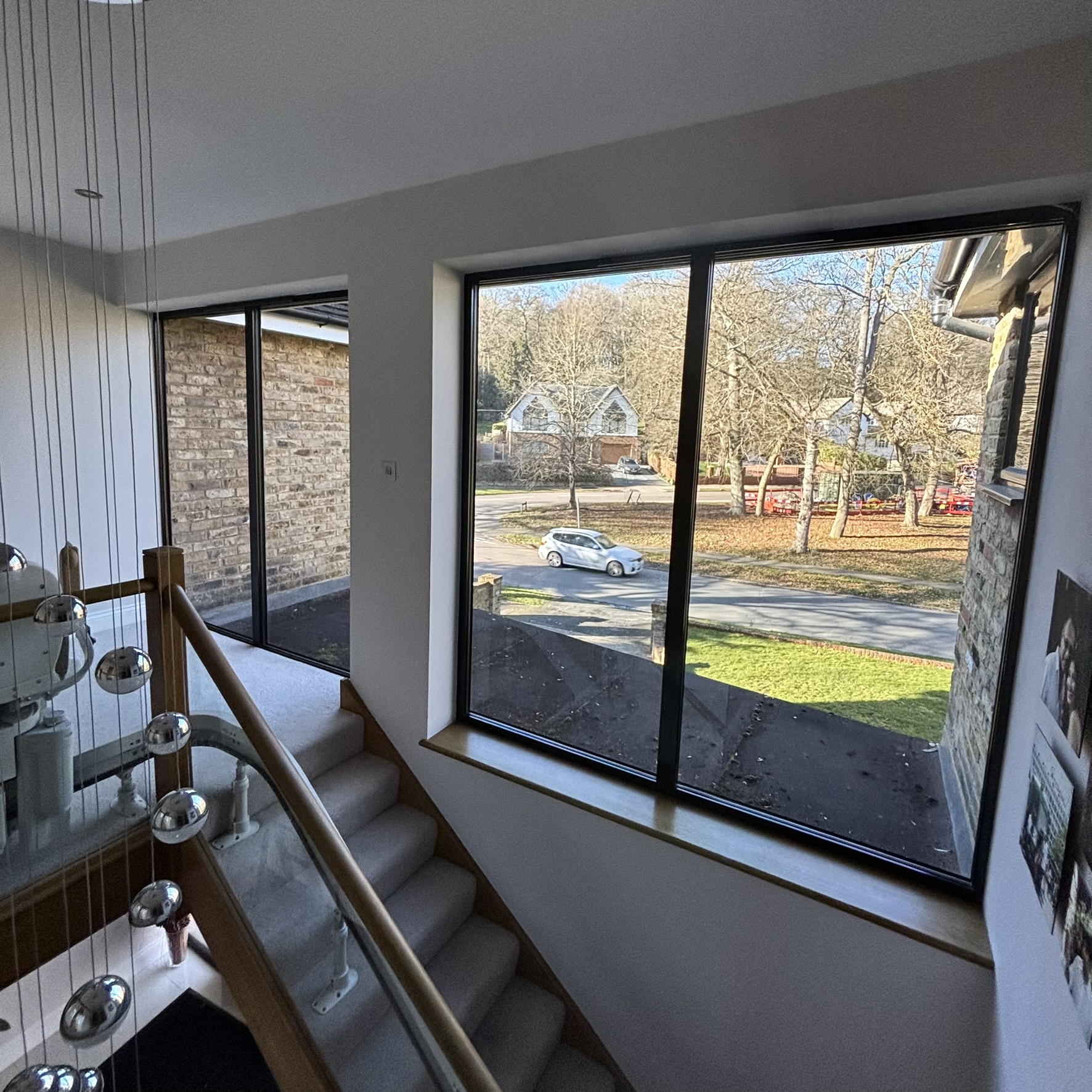 Internal view of windows in a Watford property fitted with Slate 20 tinted solar window film, showing the sleek finish and quality installation.