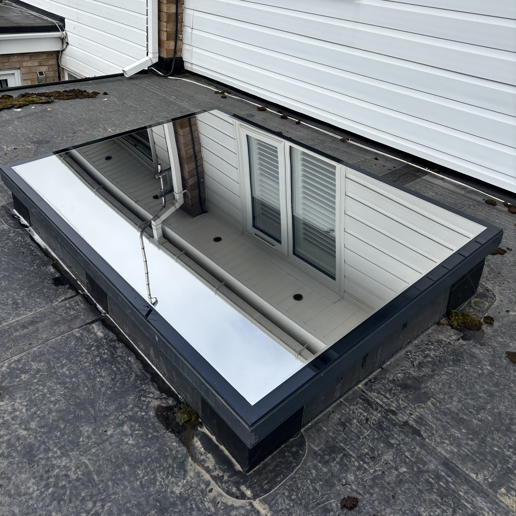 External view of a skylight in Hemel Hempstead fitted with Silver 20 reflective solar window film, helping reduce solar heat gain and protect interiors from damaging UV rays.