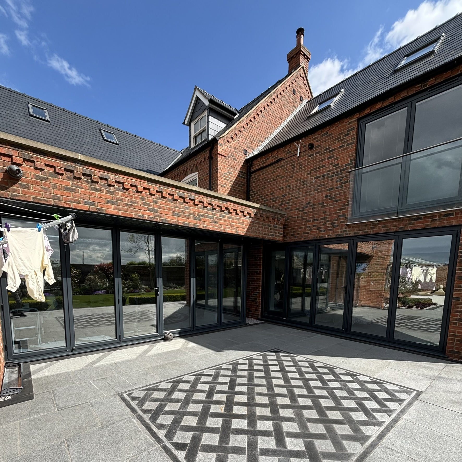 External view of a large architectural property in Louth fitted with Silver 35 reflective solar window film across the glazing, complementing the home’s appearance while improving energy efficiency.
