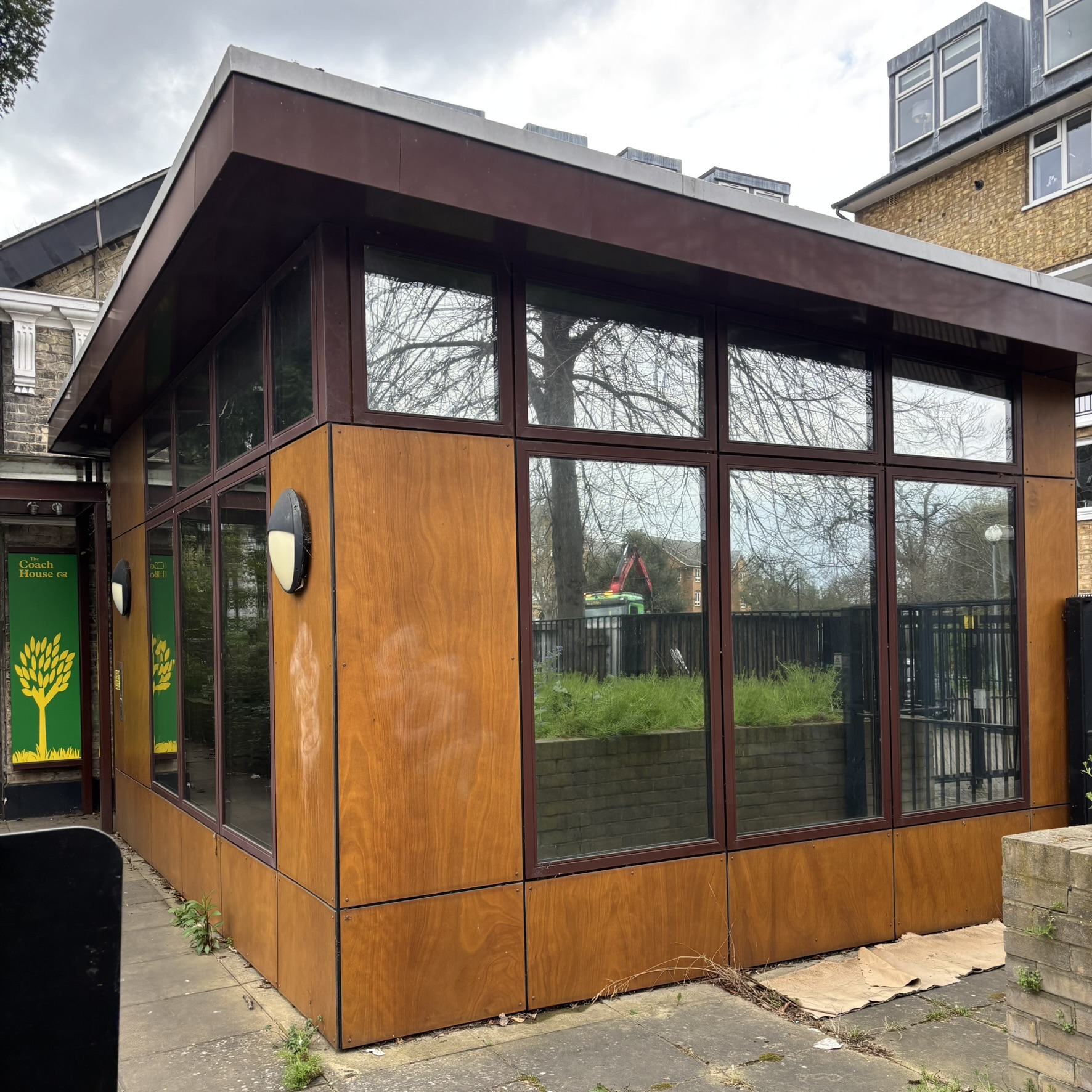 External view of a charity office in South London fitted with Silver 20 reflective solar window film, providing privacy from passers-by while improving energy efficiency and reducing cooling costs.