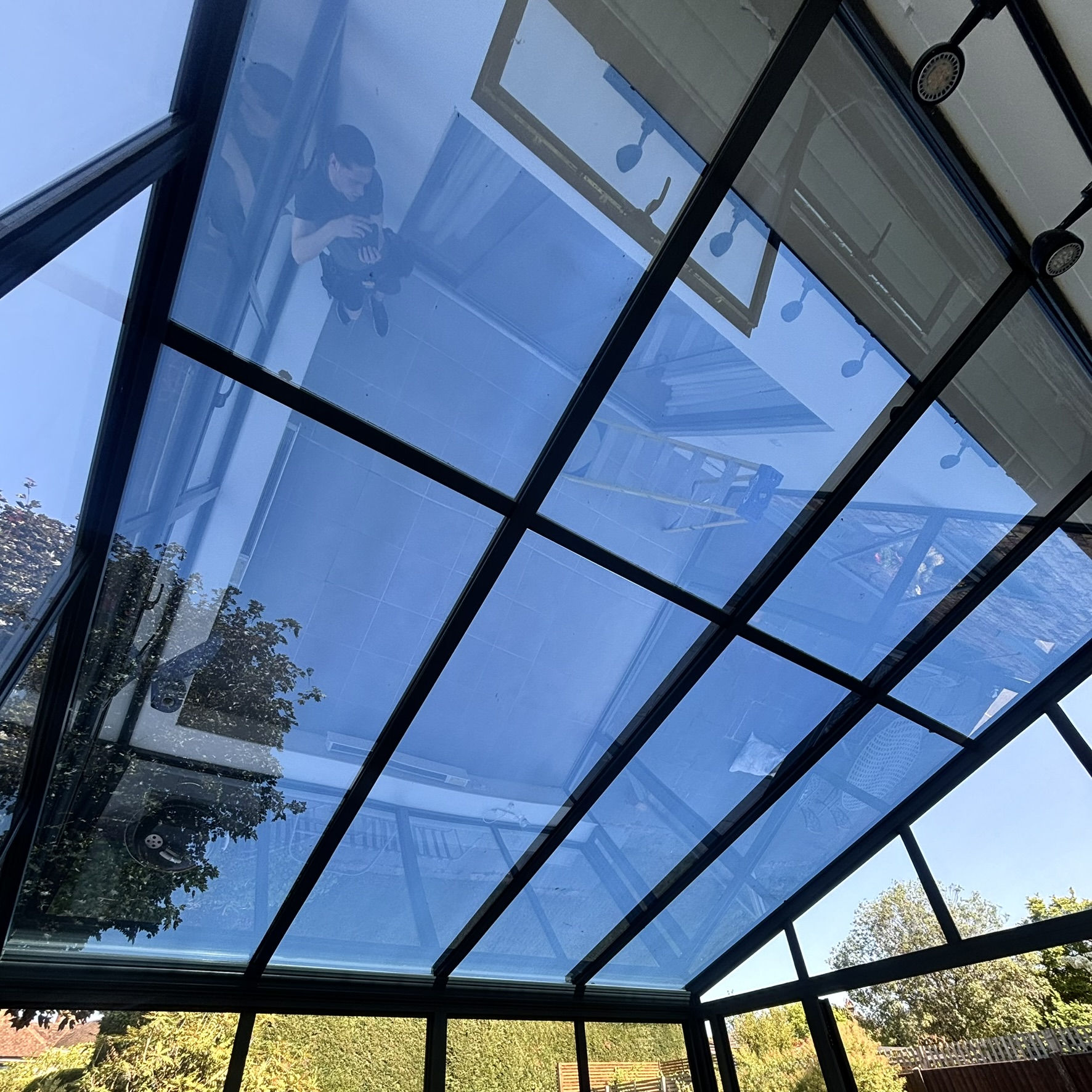 Internal view of a conservatory roof in Bishop’s Stortford, Hertfordshire, fitted with Silver 20 reflective solar window film to improve comfort and protect the space from heat and UV exposure.